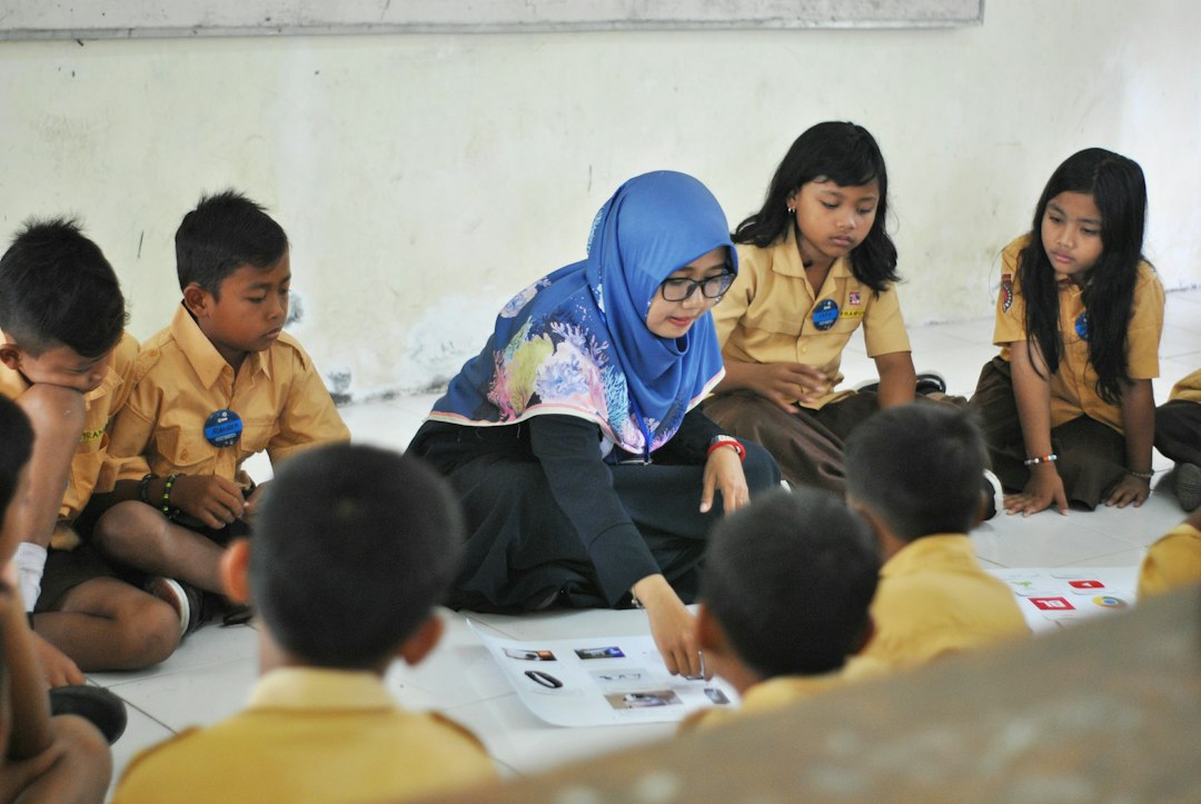 Students studying together in a classroom, representing guided vocabulary learning and language practice.