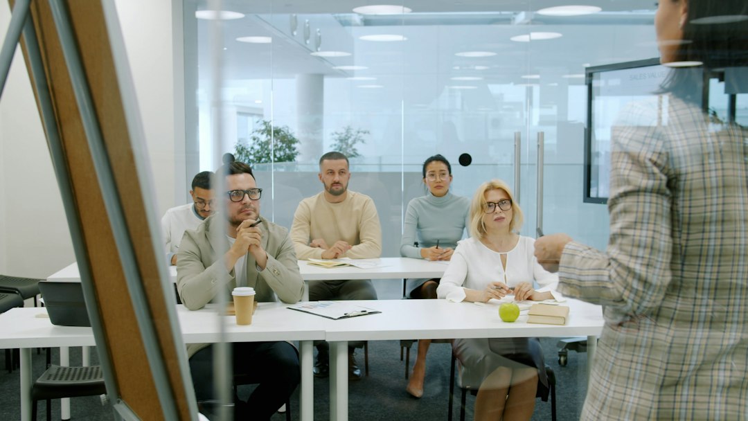 Professionals discussing a workplace training activity in an office meeting